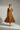 Sophia Pleated Wrap Midi Dress in Golden Truffle - model front view