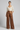 Victoria Pleated Wide Leg Trousers — Cinnamon Bronze — Model Front
