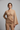 Florence Asymmetric Wrap Top in Sandalwood Beige – model front view