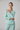 Florence Asymmetric Wrap Top in Glacier Mint – model alternate pose