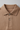 Cocoa Sand - Collar, buttons and fabric close-up