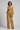 Florence Asymmetric Wrap Top in Dusty Marigold – model front view