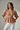 Sandstone - Model wearing Aurora Linen Peplum Top