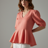 Soft Coral - Model wearing Aurora Linen Peplum Top