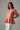 Soft Coral - Model wearing Aurora Linen Peplum Top