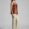 Model wearing Evelyn Draped Cowl Neck Top in Mahogany Copper alternate pose