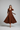 Sophia Pleated Wrap Midi Dress in Chestnut Amber - model front view