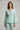 Florence Asymmetric Wrap Top in Glacier Mint – model front view